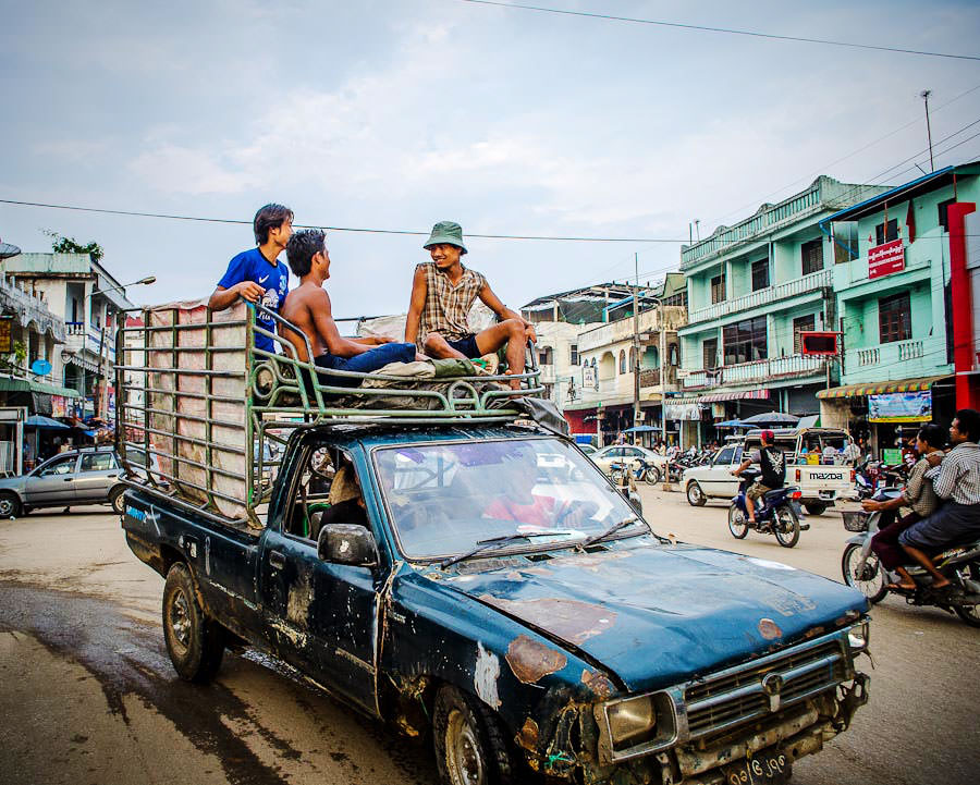 Burmese workers arriving back to town after a day of working the fields of Myanmar.